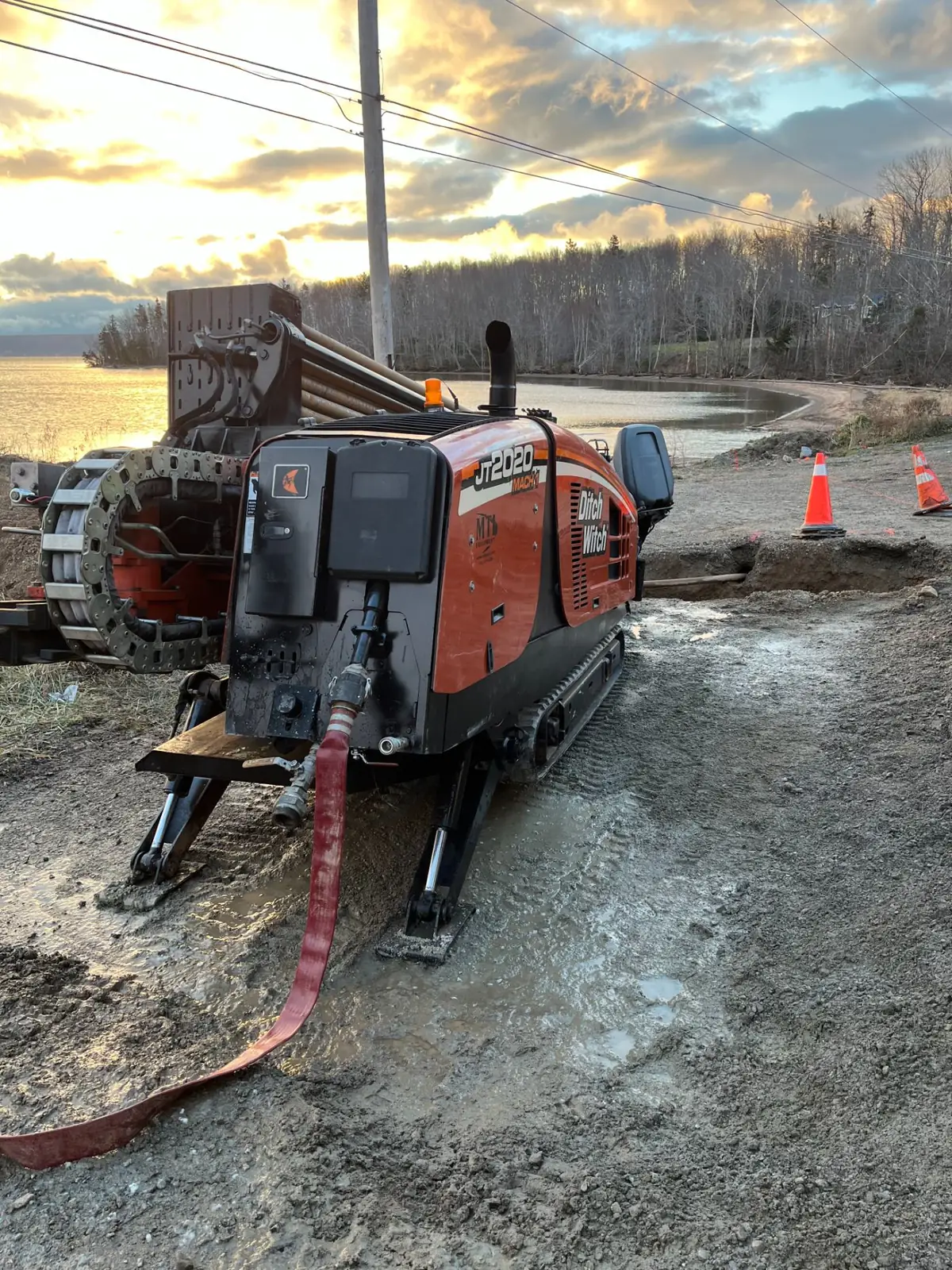 WM Directional Drilling rig on a shoreline installation at sunset